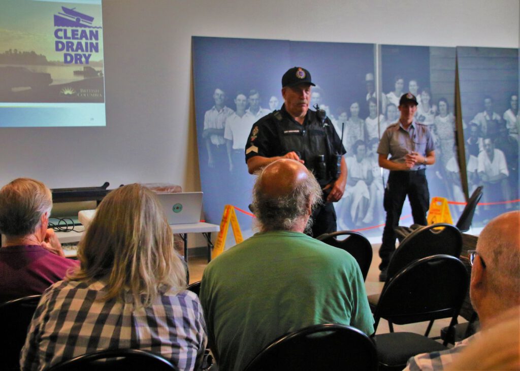 SGT J.D. Lockwood and Inspection Officer Sharon Crocker speak with audience about keeping invasive mussels out of Osoyoos Lake. Photo Credit Neil Bousquet